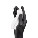 PhiAcademy Phi Wipes After Care 5pcs — aftercare cleansing wipe held in a gloved hand