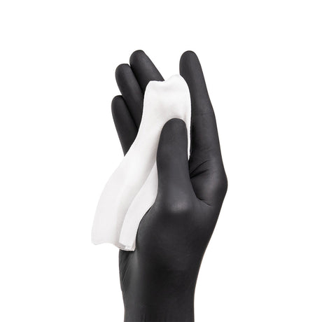 PhiAcademy Phi Wipes After Care 5pcs — aftercare cleansing wipe held in a gloved hand