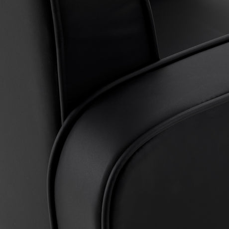 Black Omega Andromeda hairdressing chair with adjustable headrest and armrests, featuring sleek modern design.