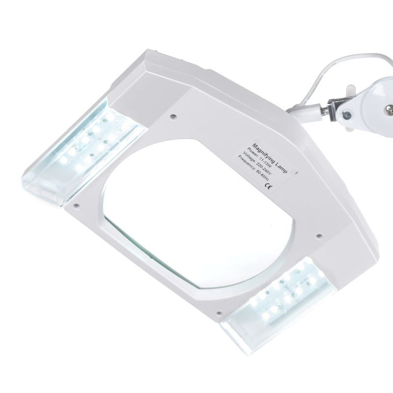 Beauty System BN-208L LED lamp with built-in loupe on tripod for precise close-up illumination and magnification.